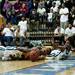 Huron and Ypsilanti players reach for a loose ball during the final quarter of the game on Friday, March 8. Daniel Brenner I AnnArbor.com